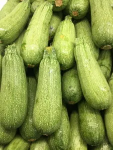 many unprepared, unpeeled zucchinis